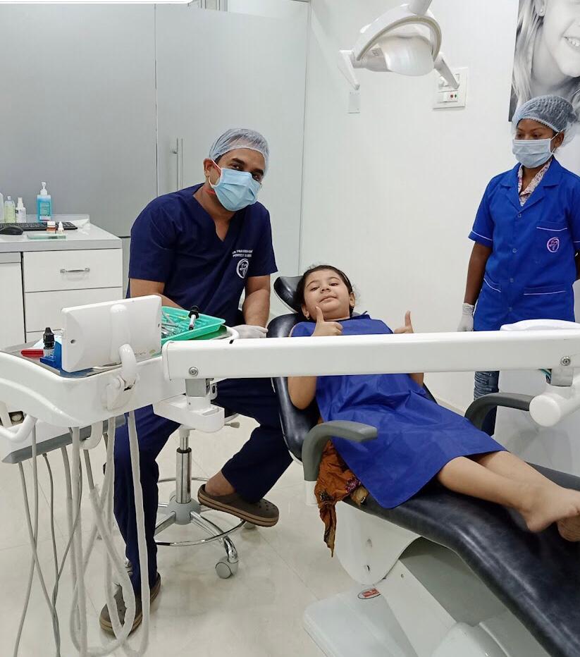 Child patient smiling during a dental checkup at Perfect 32 Dental Clinic, Ranchi